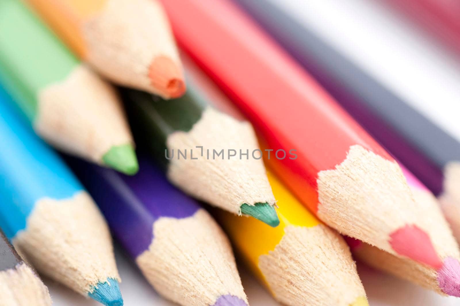 Pile of colored pencils, sharpened for drawing.