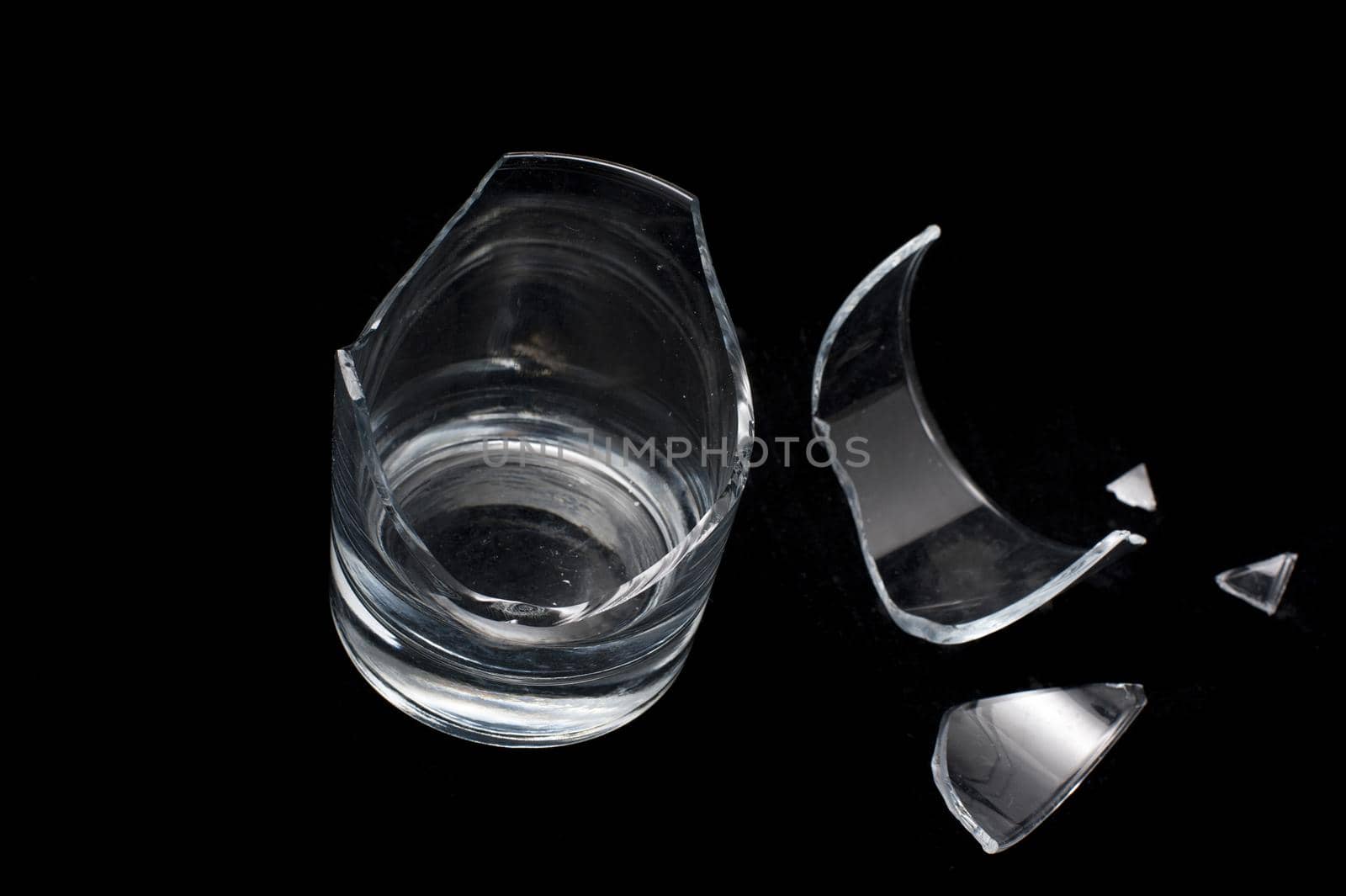 Close up Shot of Conceptual Broken Glass Isolated on Black Background