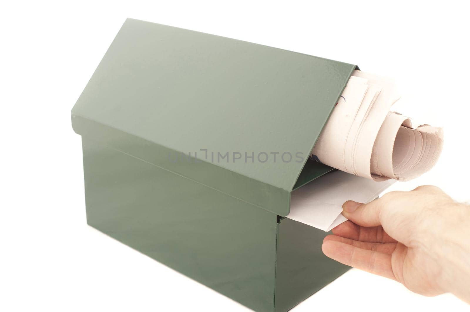 Conceptual Human Hand Pulling a Mail From the Box. Isolated on White Background. Emphasizing Copy Space.