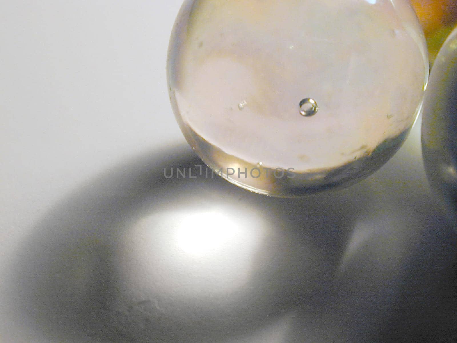 a glass marble with light shining through it