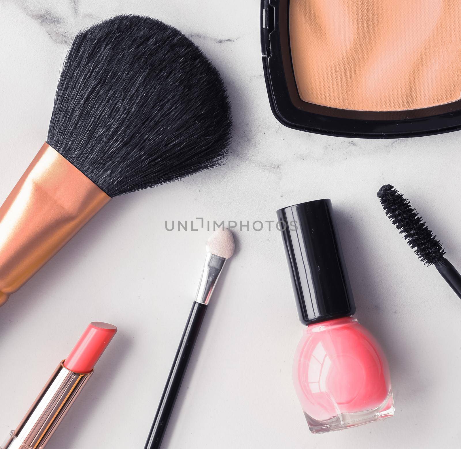 Make-up and cosmetics flatlay on marble by Anneleven