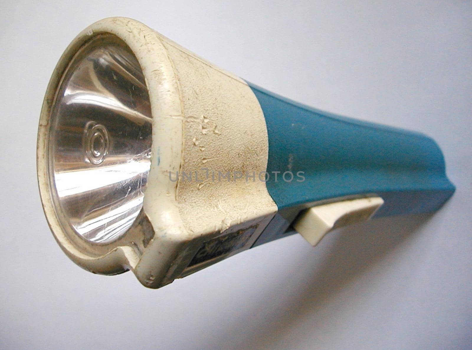 Still Life of Old Flashlight Torch with Blue Handle, Unlit on White Background