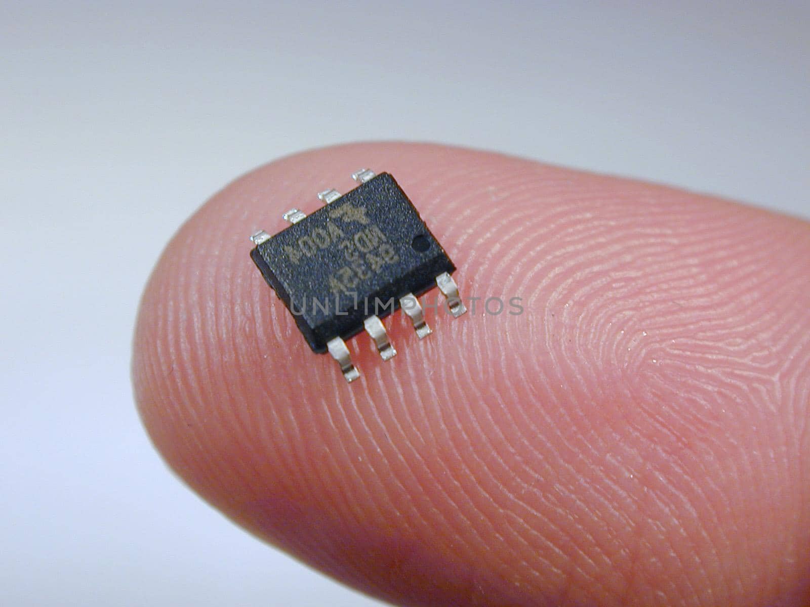 tiny surface mount integrate circuit on a finger tip