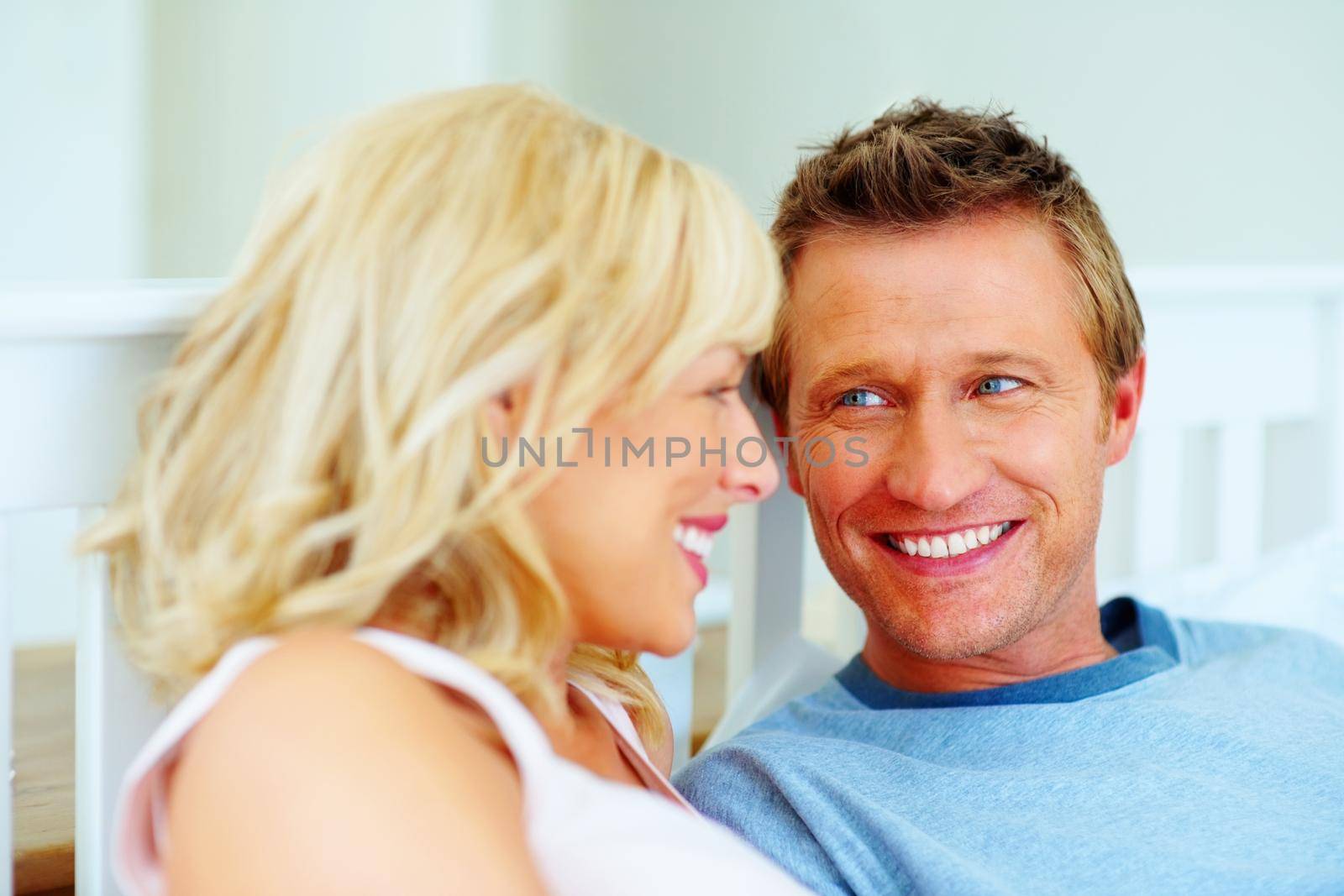 Romantic middle aged couple looking at each other. Portrait of a romantic middle aged couple looking at each other