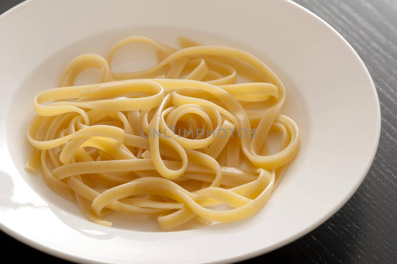 Simple White Plate of freshly cooked Pasta