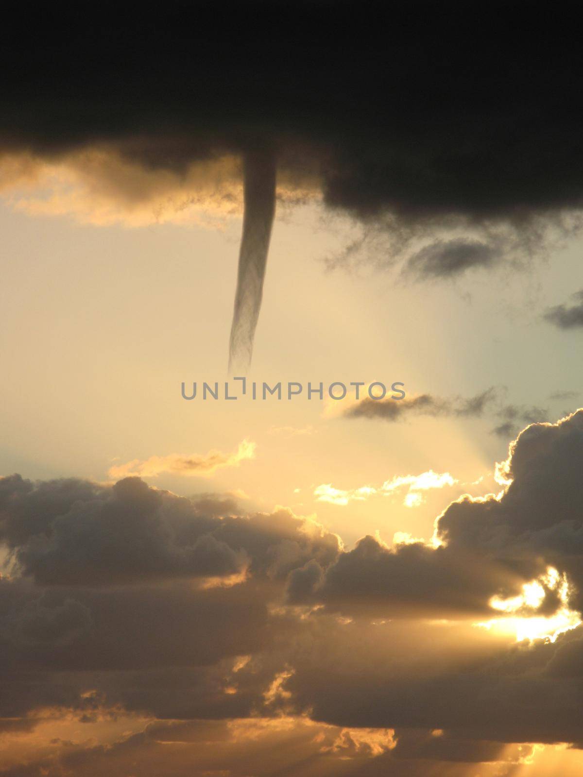 A cold air funnel cloud, like a mini tornado but is not in contact with the ground