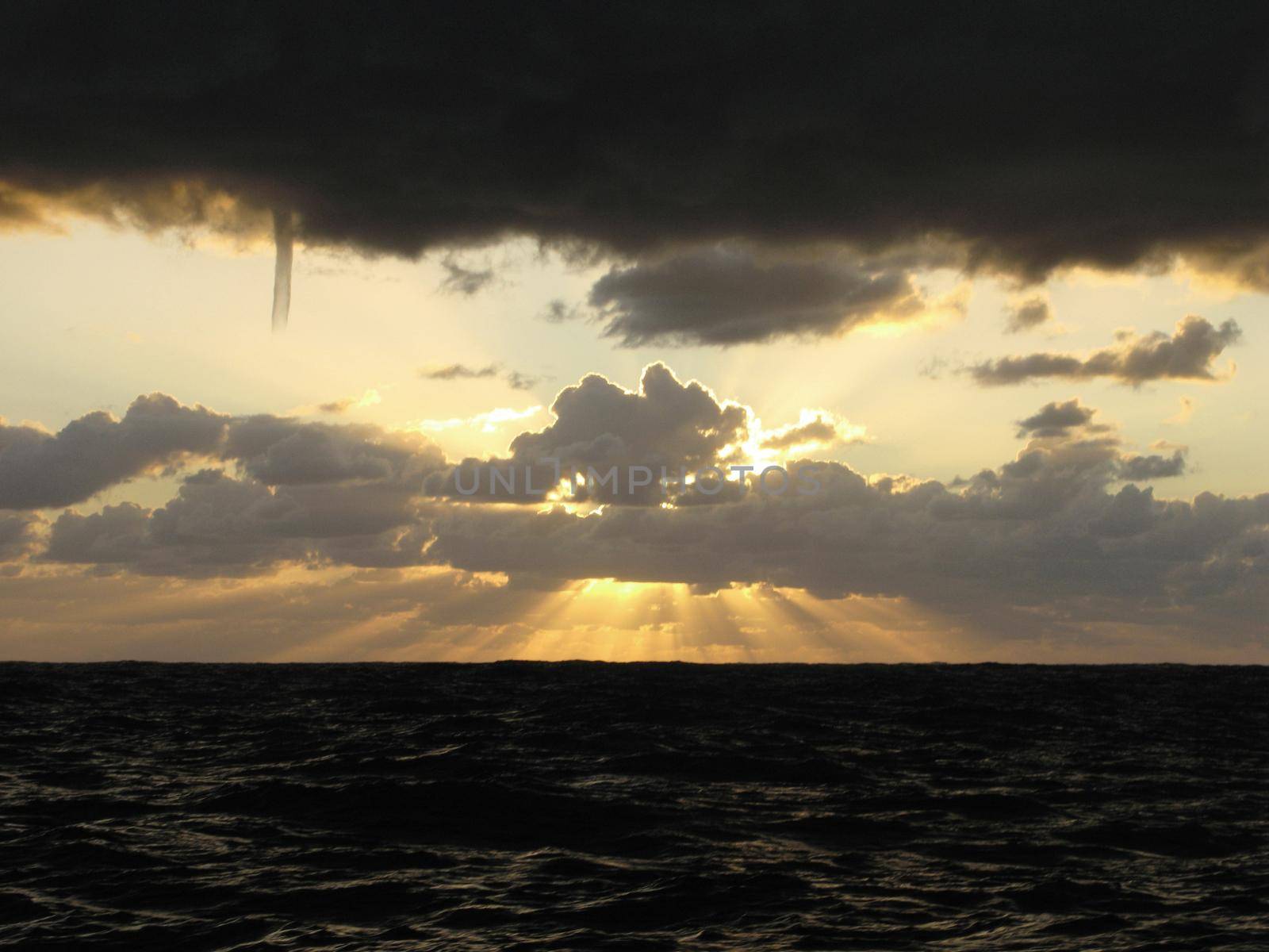 A cold air funnel cloud,  is like a small tornado but it does not contact the ground or ocean