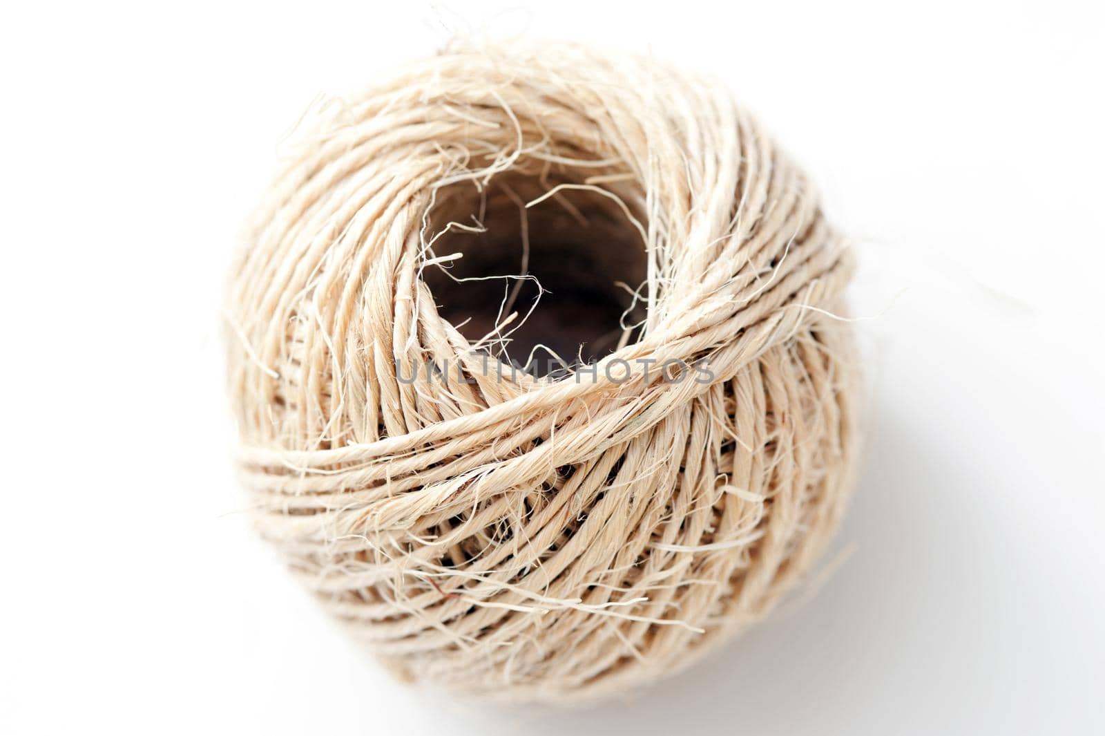 Close up Aerial Shot of Ball of Twine Isolated on White Background