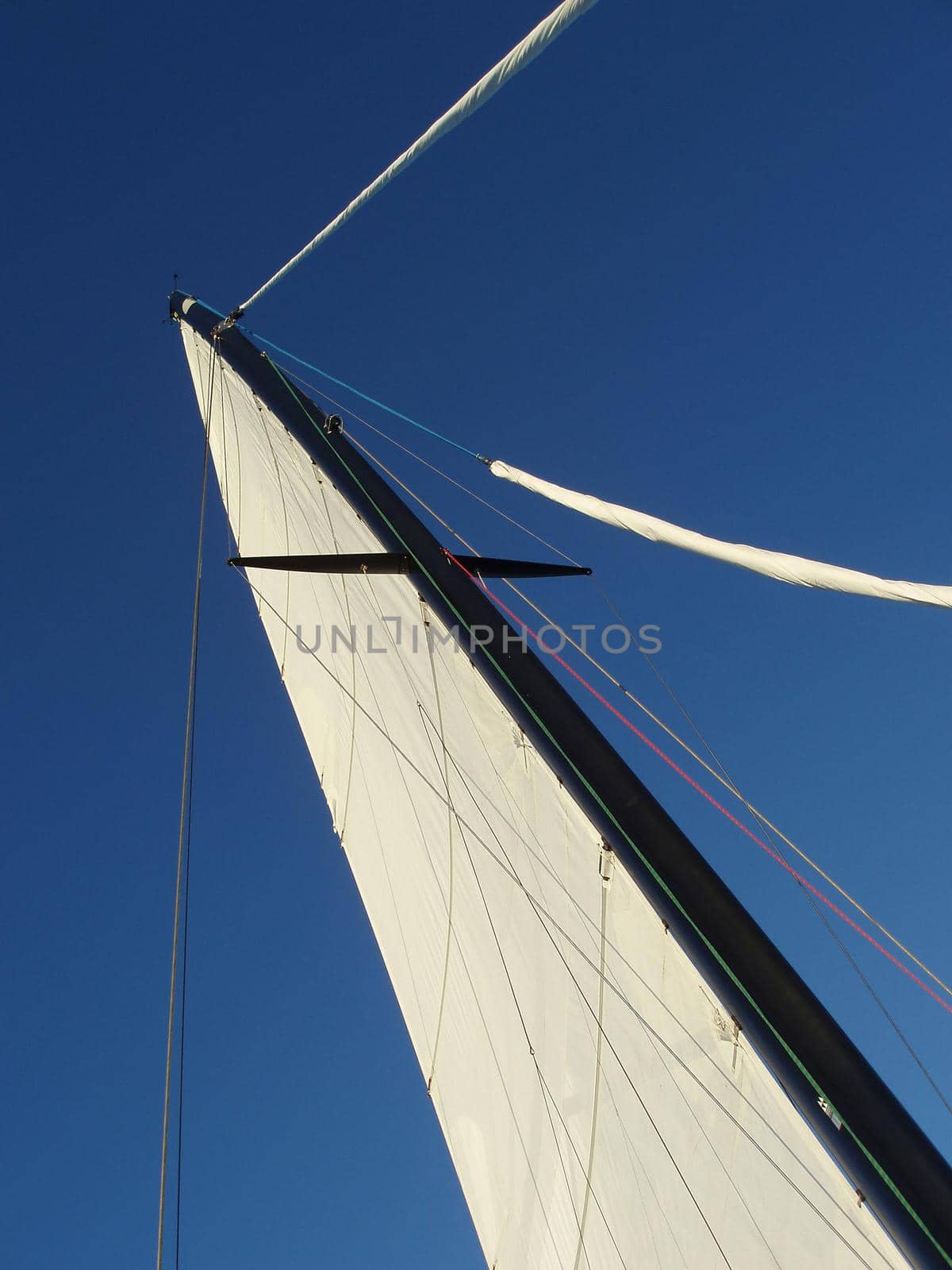 laying on the deck of a sailing yacht looking up at the sky