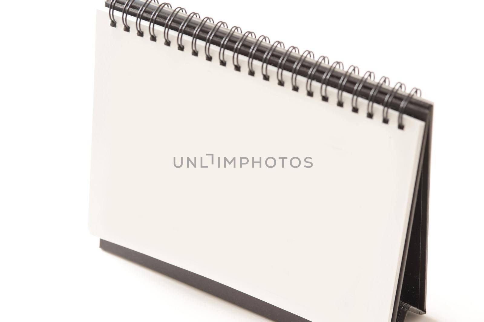 Close up Standing White Spiral Blank Flip Chart Isolated on White Background, Emphasizing Copy Space.