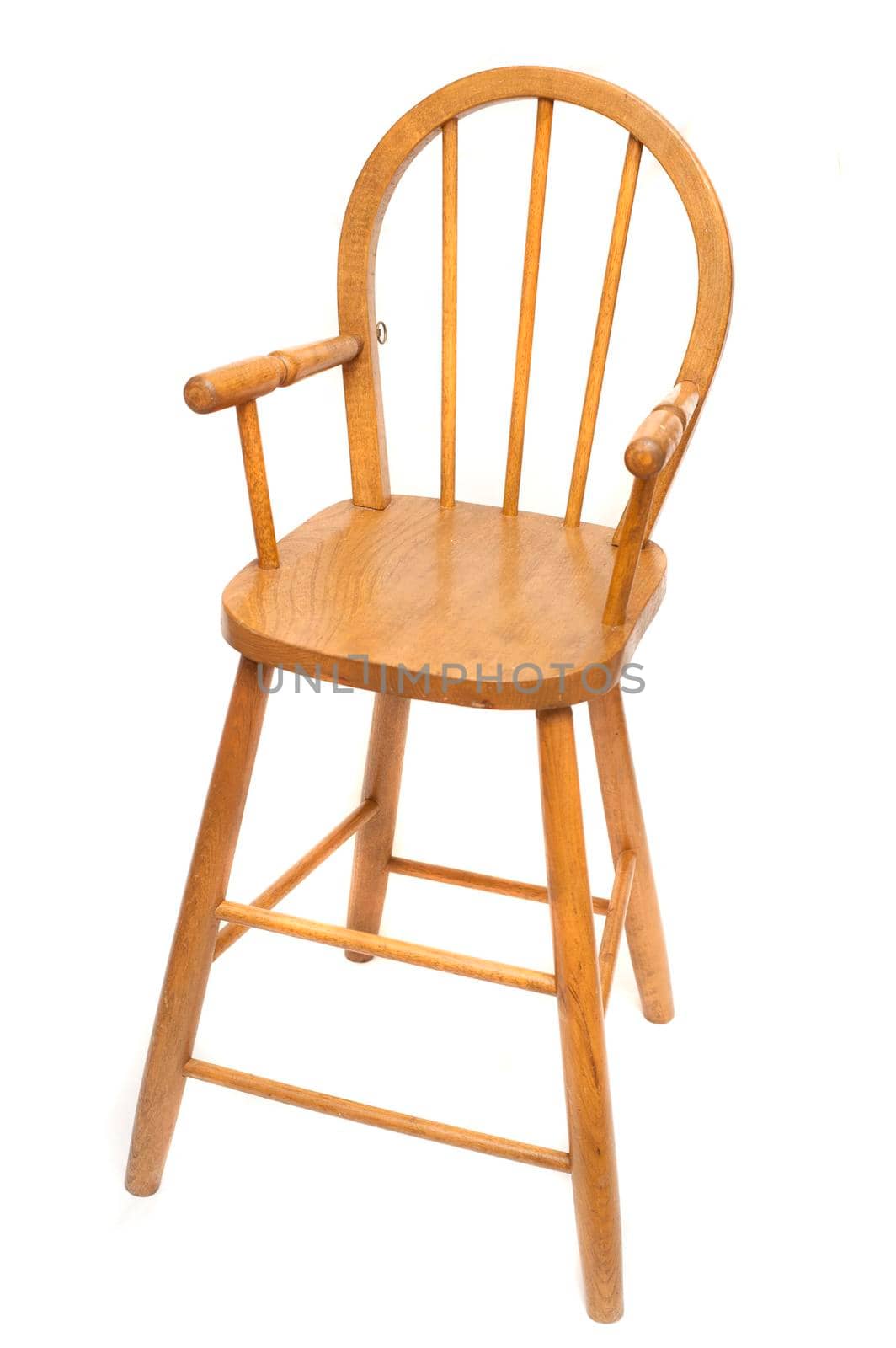 Traditional wooden oak high chair isolated on white for feeding a baby or toddler