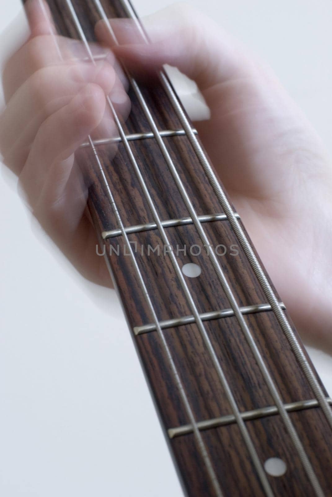 someone playing the bass guitar