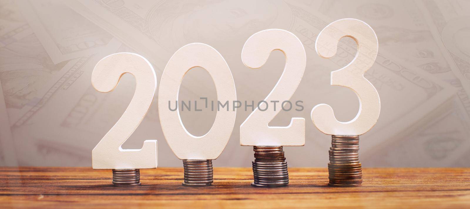 2023 on the stack of coins. tax payment, investment, and banking concept. 2023 new year saving money and financial planning concept by Maximusnd