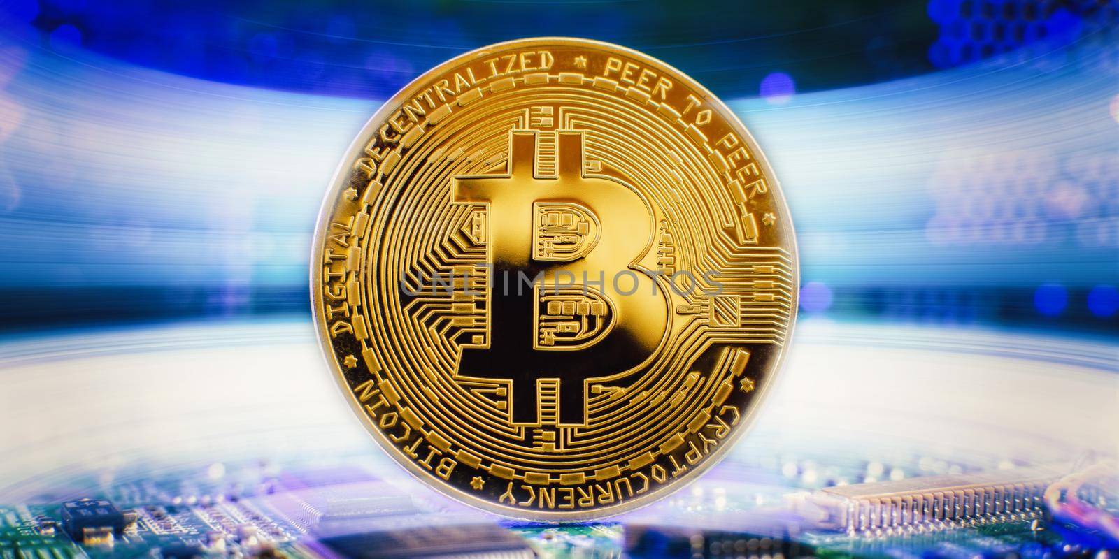 Golden cryptocurrencies Bitcoin golden coin on computer circuit board. banner copy space by Maximusnd