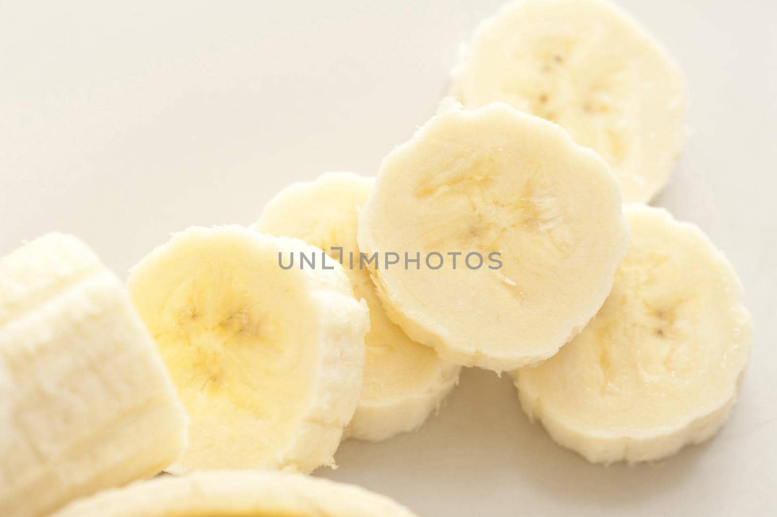 Close-up of chopped banana on white table