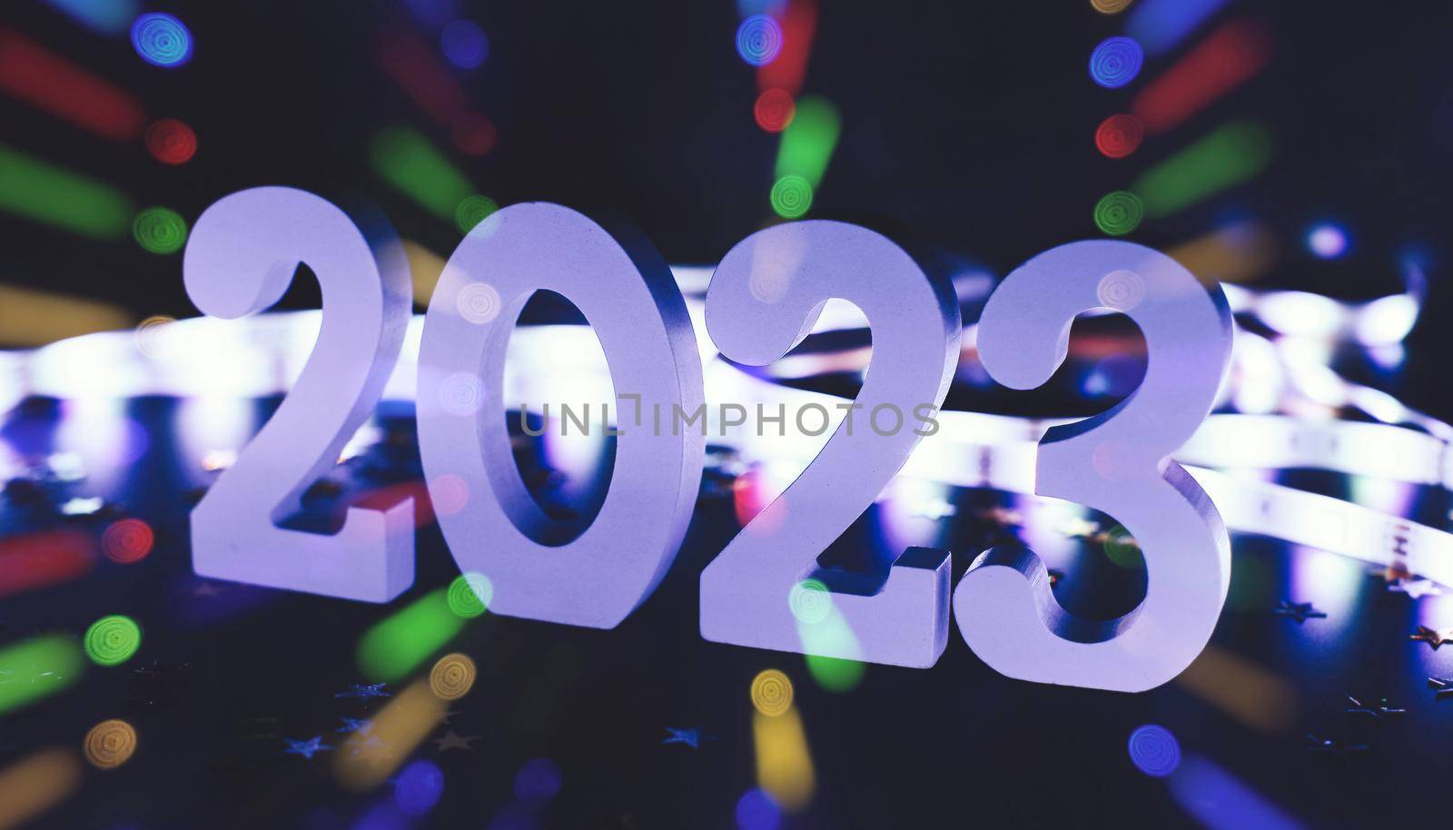 New Year 2023.  Blurred lights in the background. by Maximusnd