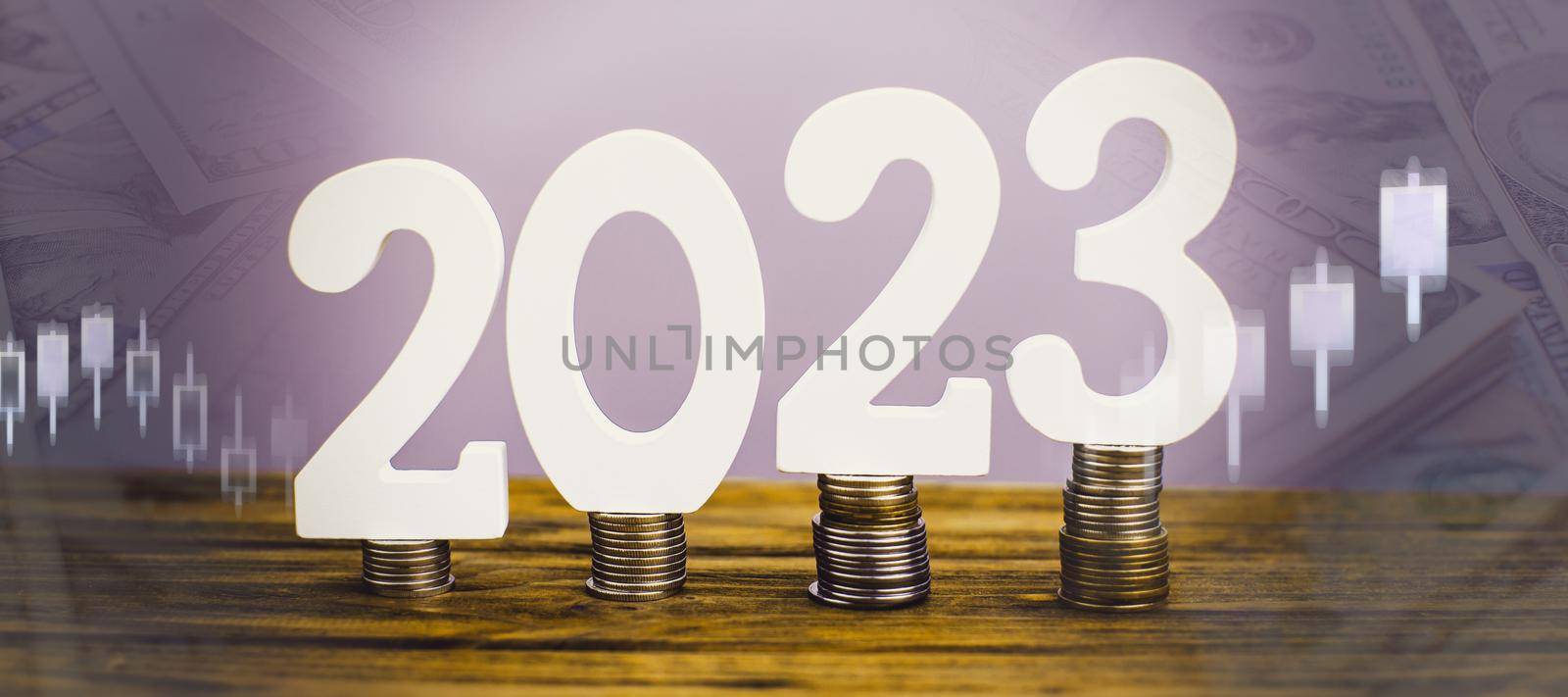 2023 on the stack of coins. tax payment, investment, and banking concept. 2023 new year saving money and financial planning concept