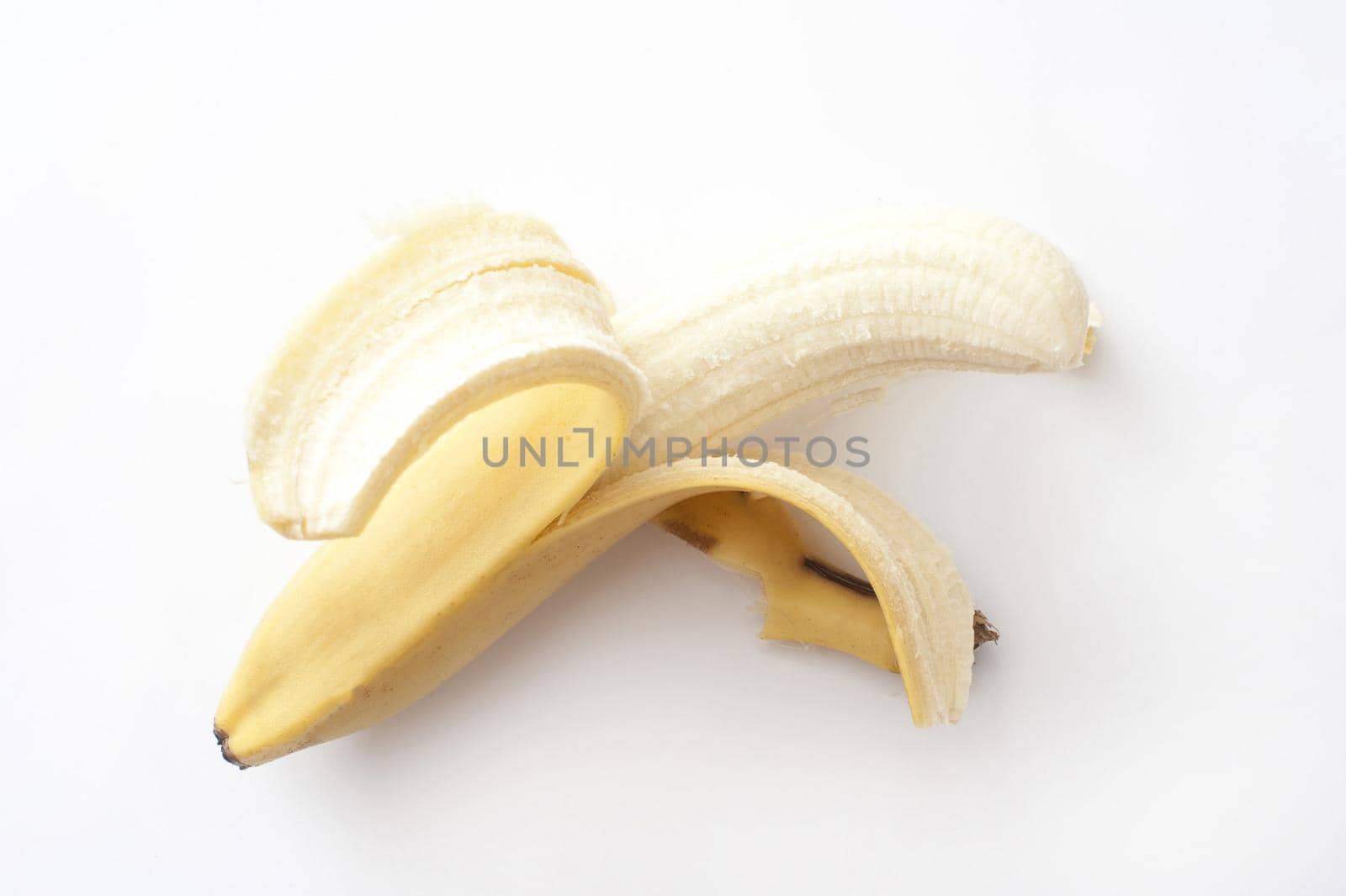 Peeled banana on white background.Isolated