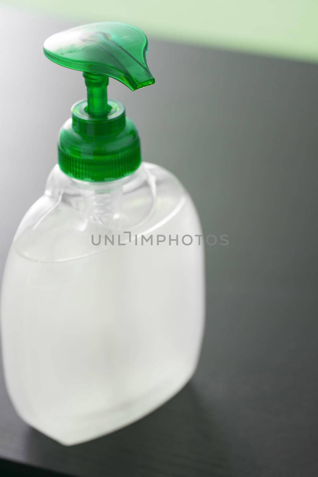 Close up on an unlabelled bottle of hand sanitizer with pump action in a concept of personal hygiene and and washing during the Covid-19 pandemic