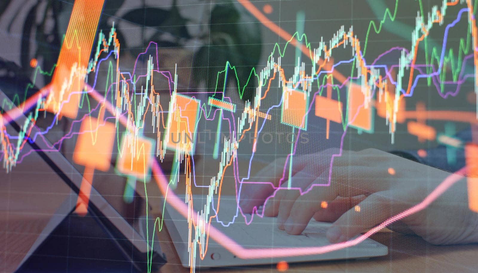 Charts of financial instruments with various type of indicators including volume analysis for professional technical analysis on the monitor of a computer.