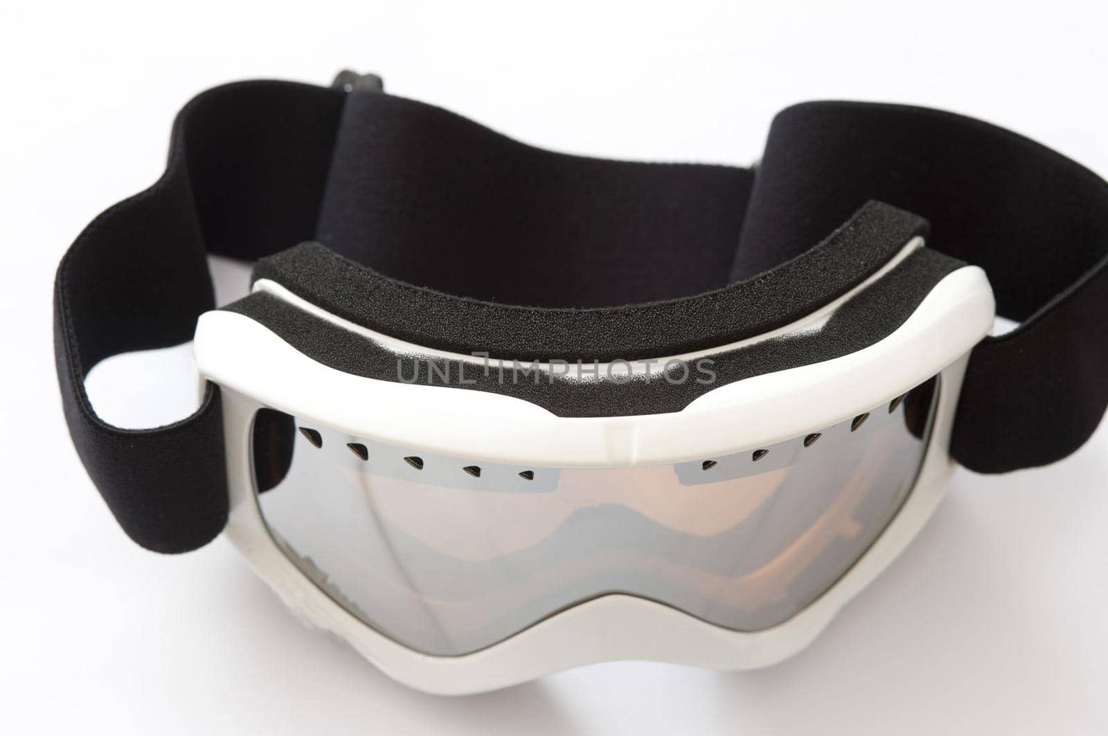 Snowboarding goggles on a white background in a winter sport, vacation and healthy active lifestyle concept