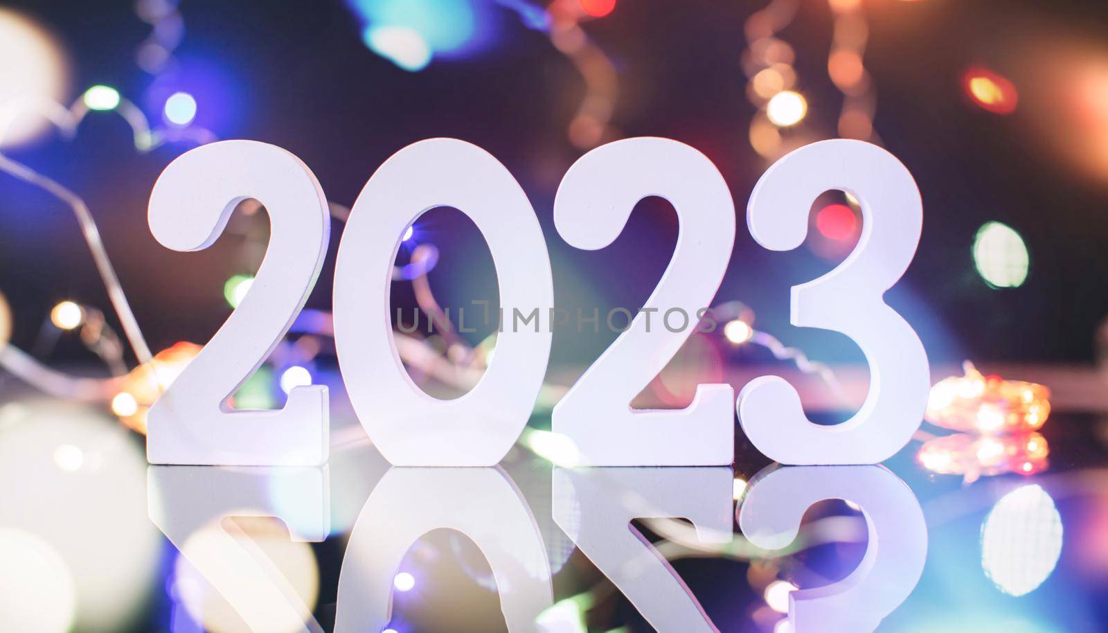New Year 2023.  Blurred lights in the background. by Maximusnd