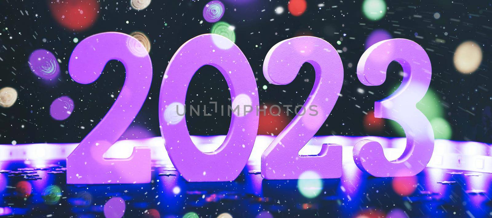 New Year 2023.  Blurred lights in the background. by Maximusnd