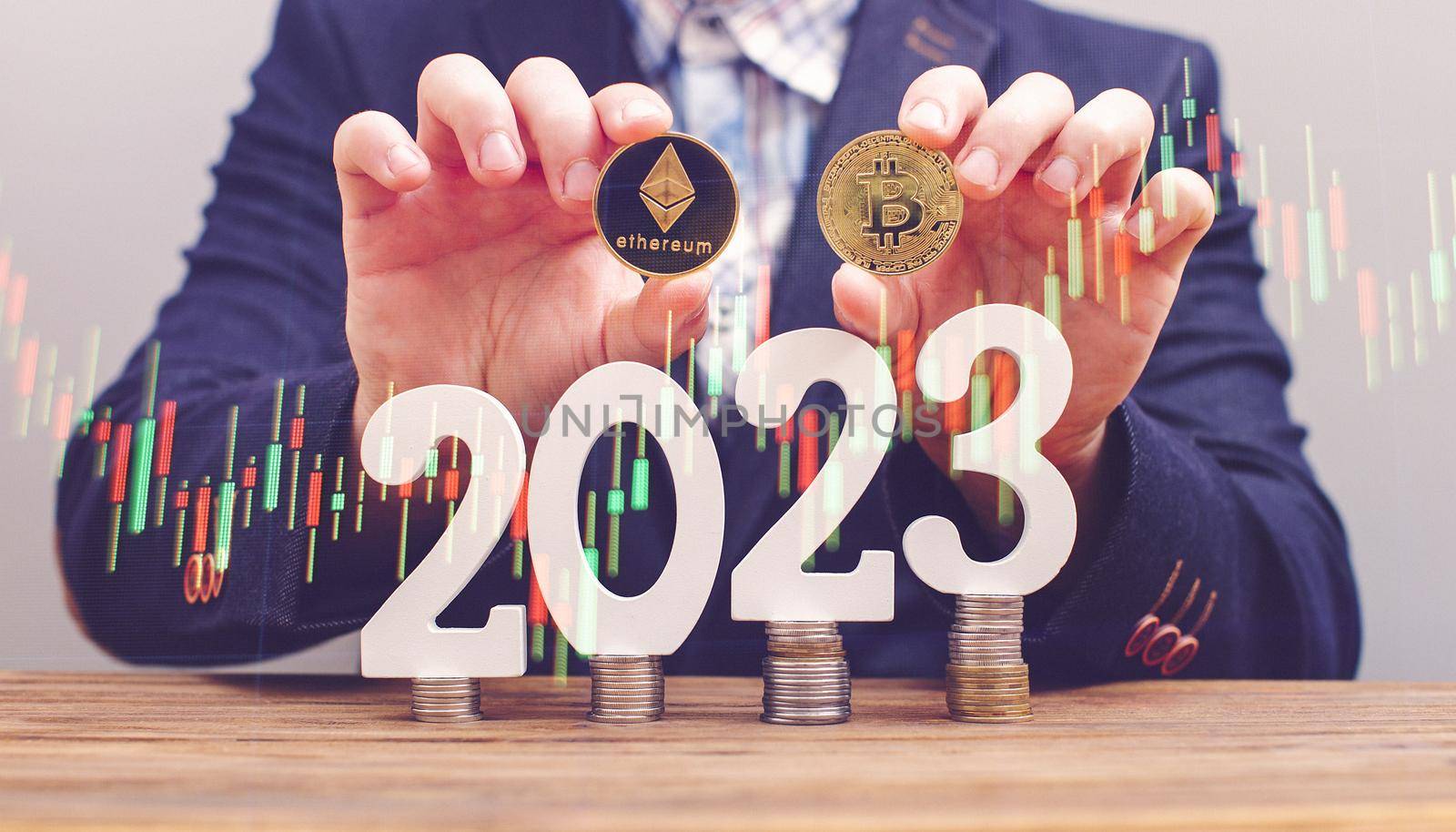 Businessman thinking about investing in cryptocurrency in 2023, choice between Ethereum and Bitcoin against the background of the chart by Maximusnd