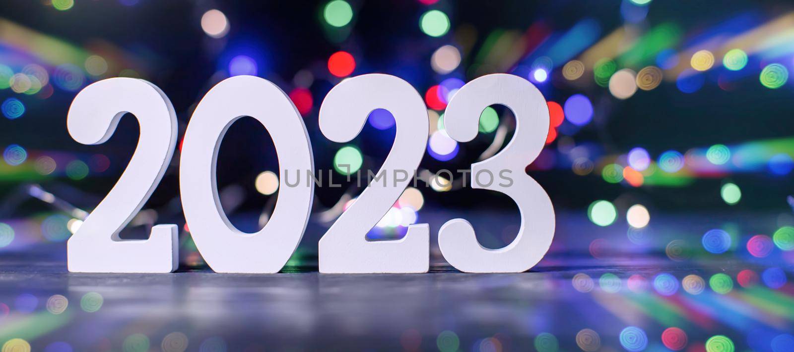 New Year 2023.  Blurred lights in the background. by Maximusnd