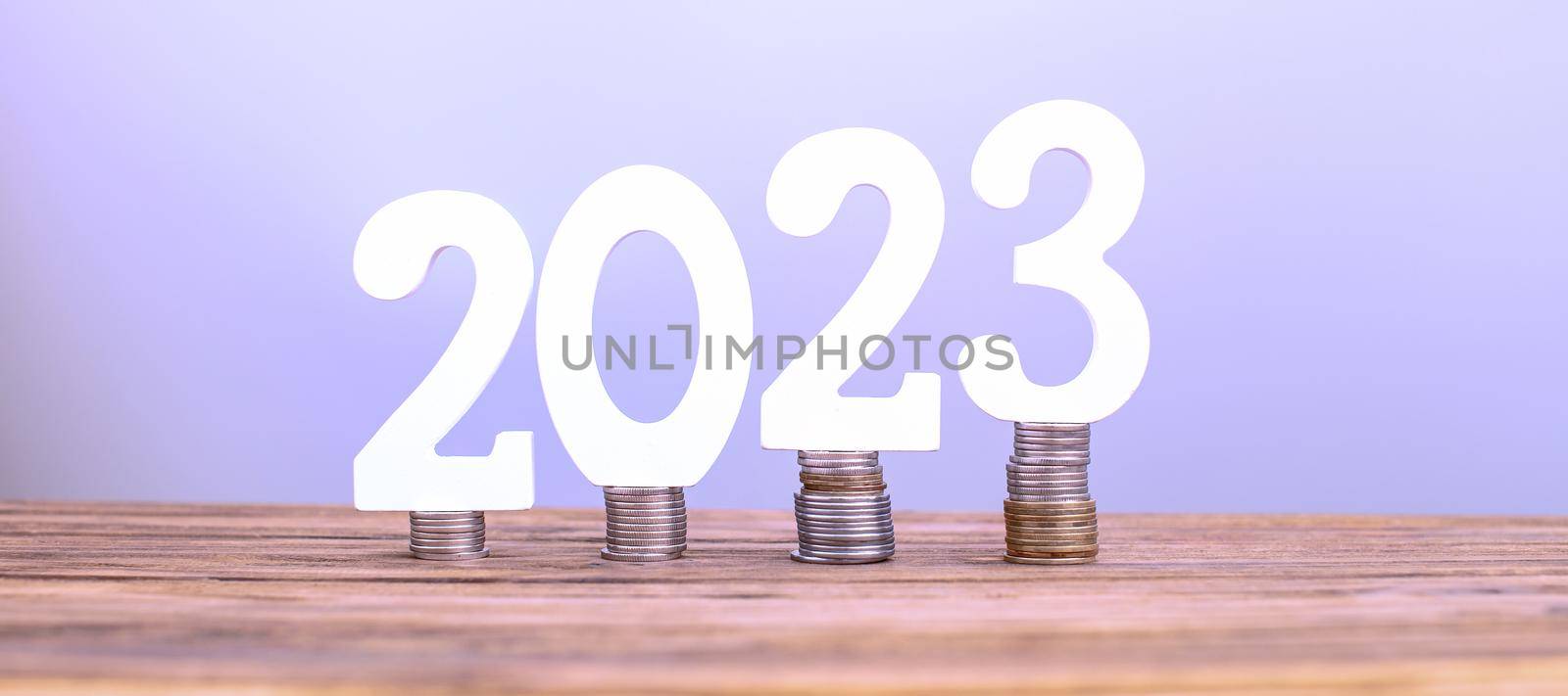 2023 on the stack of coins. tax payment, investment, and banking concept. 2023 new year saving money and financial planning concept