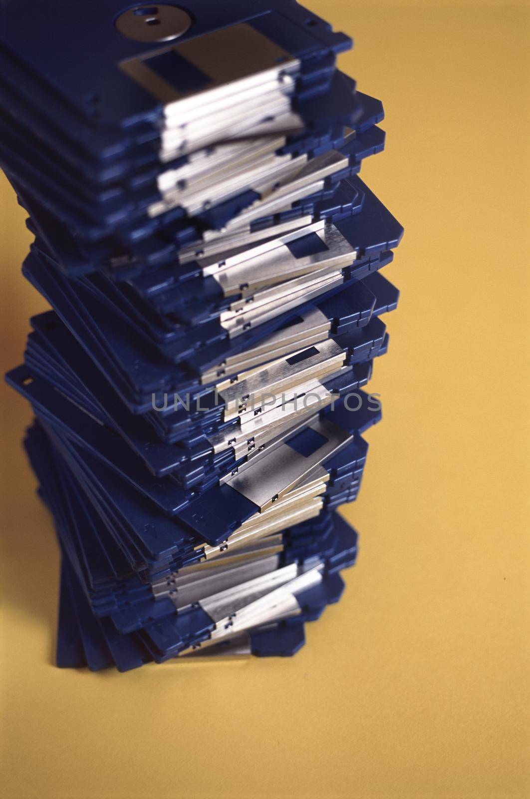 a stack of floppy disks, out of date data storage