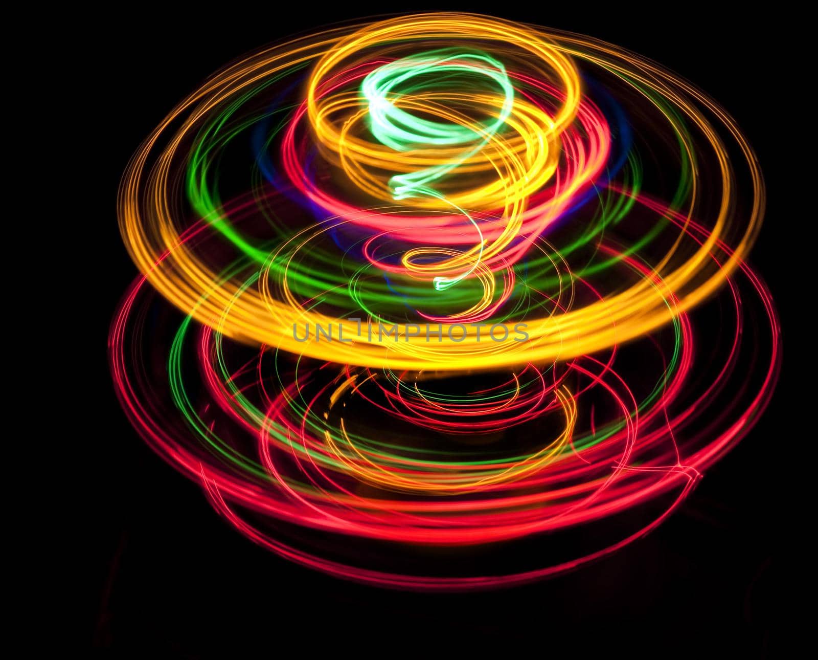 a blazing display of colored glowing lines forming abstract corkscrew patterns