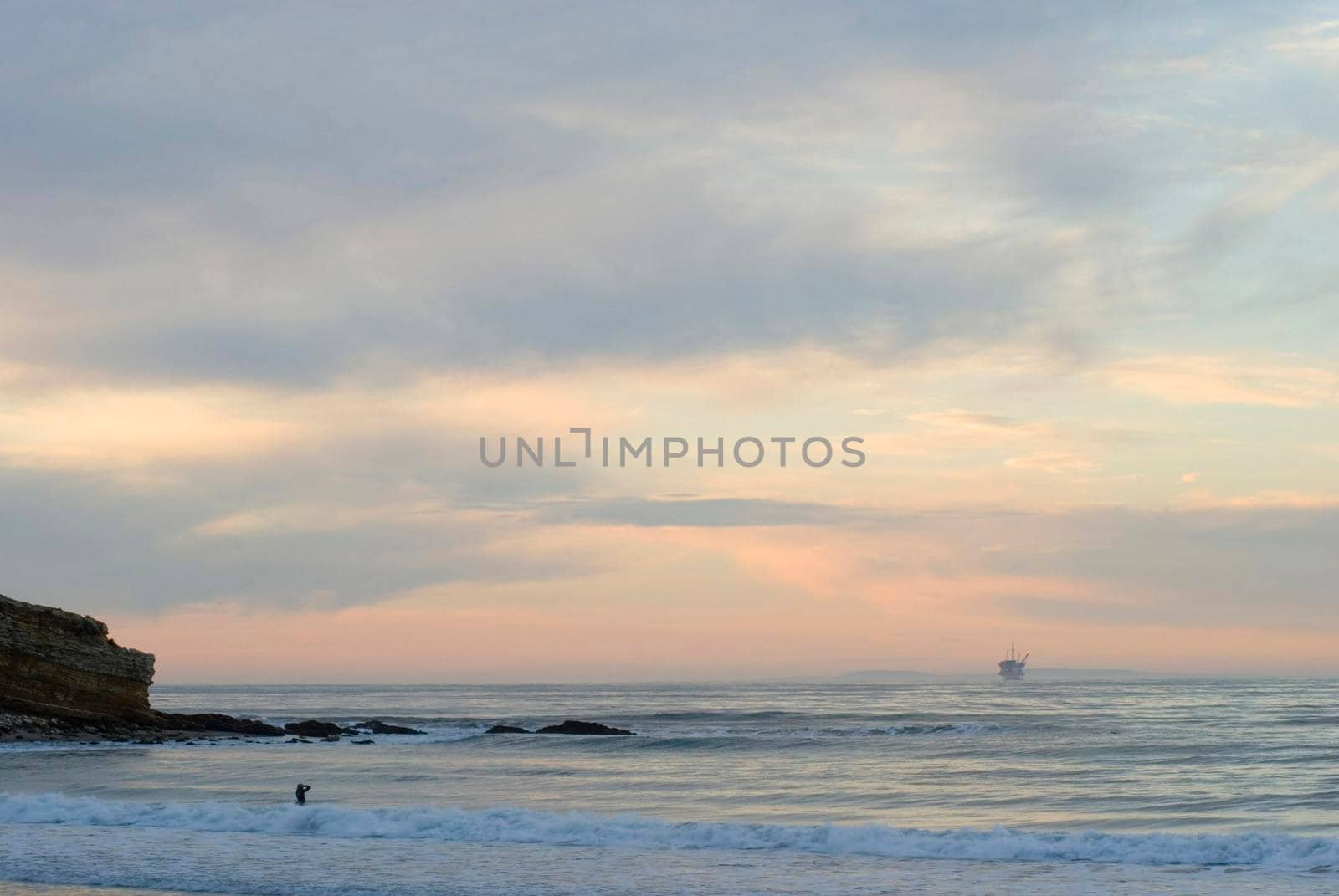 sunset from refugio, orange sky and offshore oil platforms