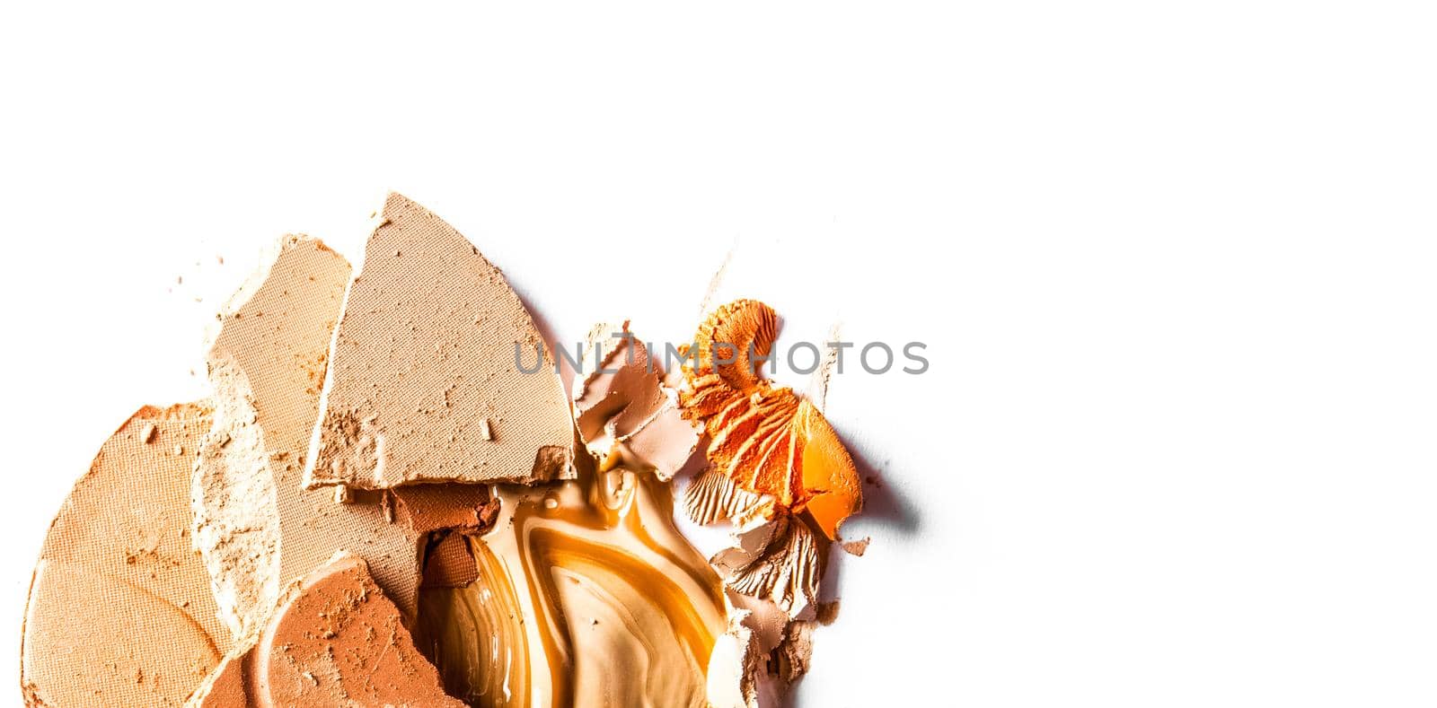 Crushed eyeshadow, powder and liquid foundation close-up isolated on white background by Anneleven