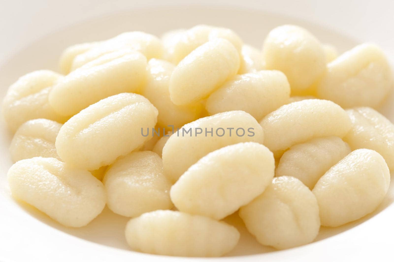 Close-up of many uncooked gnocchi on plate