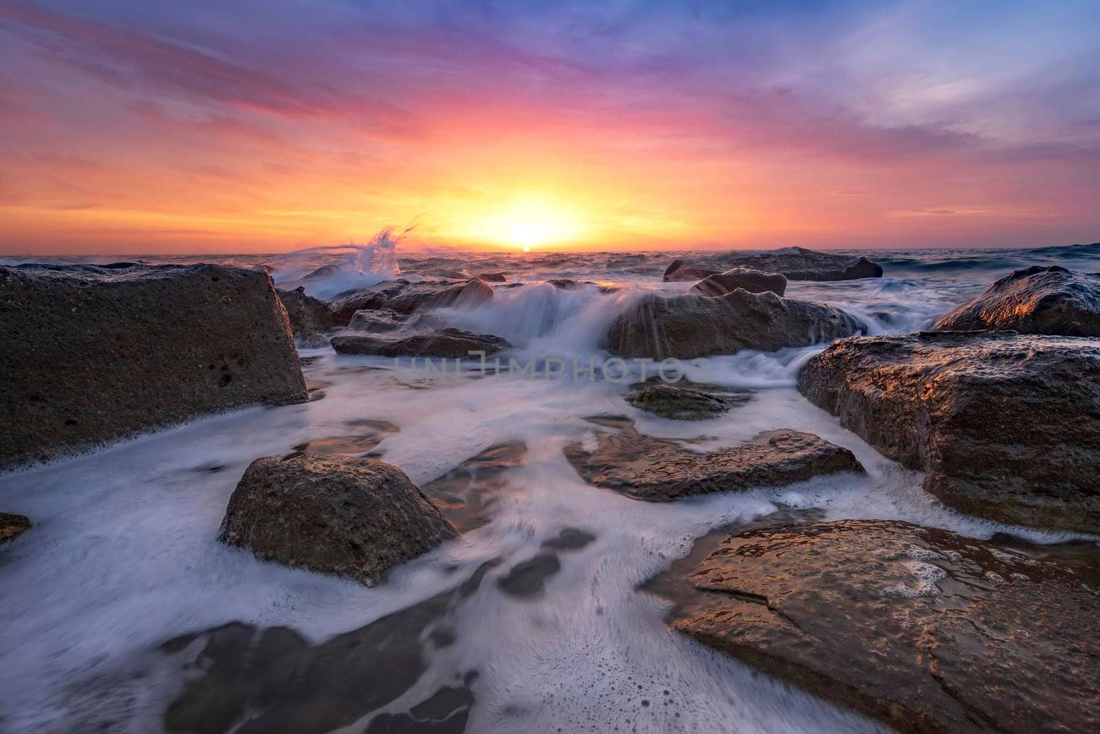 Stunning fire sunrise over the sea. Horizontal view
