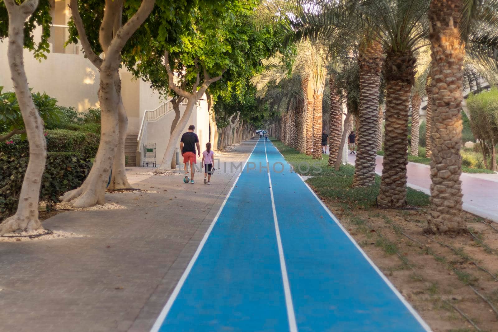 Dubai, UAE - 05.15.2021 - Jogging and cycling tracks at Al Ittihad park in Palm Jumeirah. Outdoors by pazemin