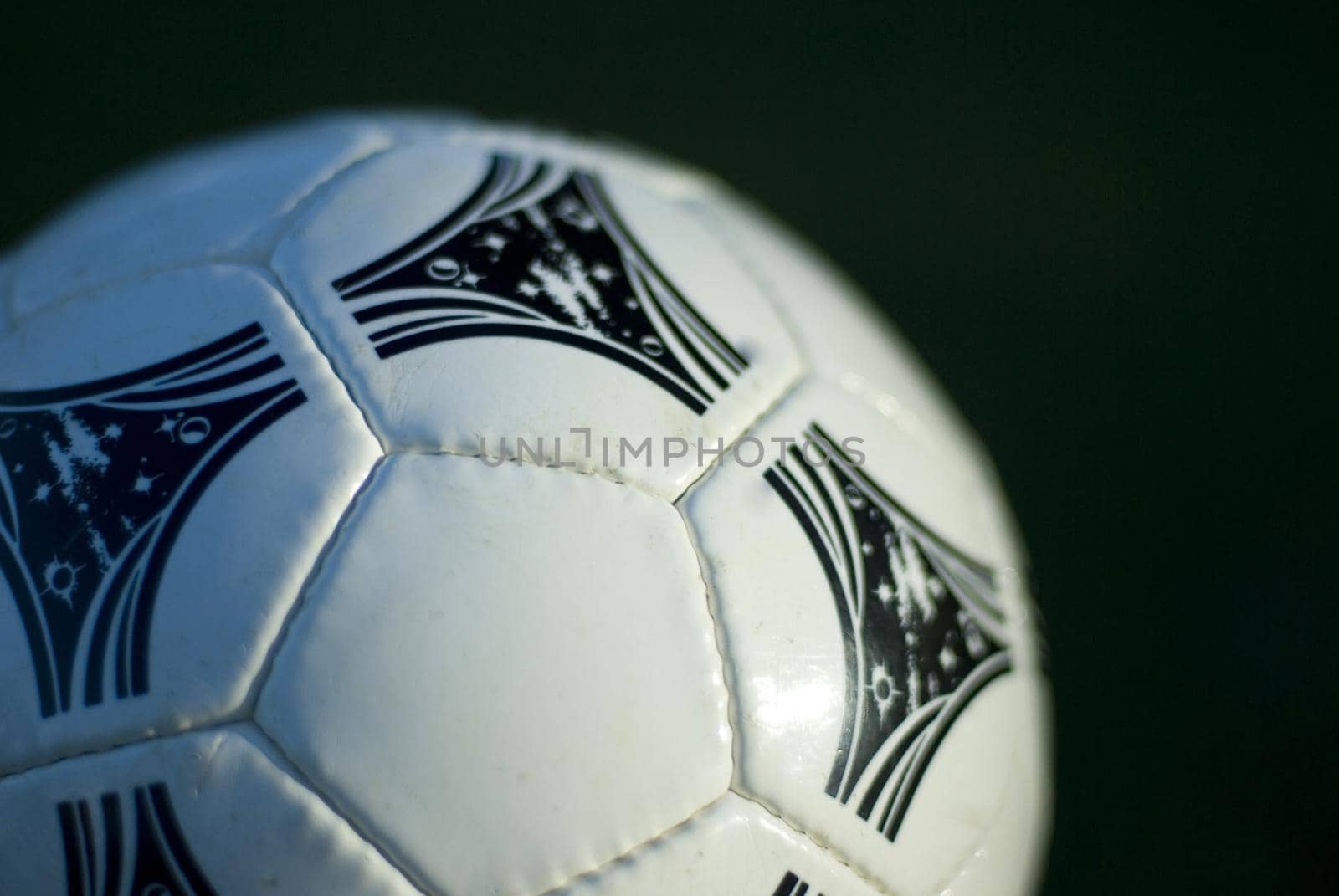 close up on a white leather soccer ball