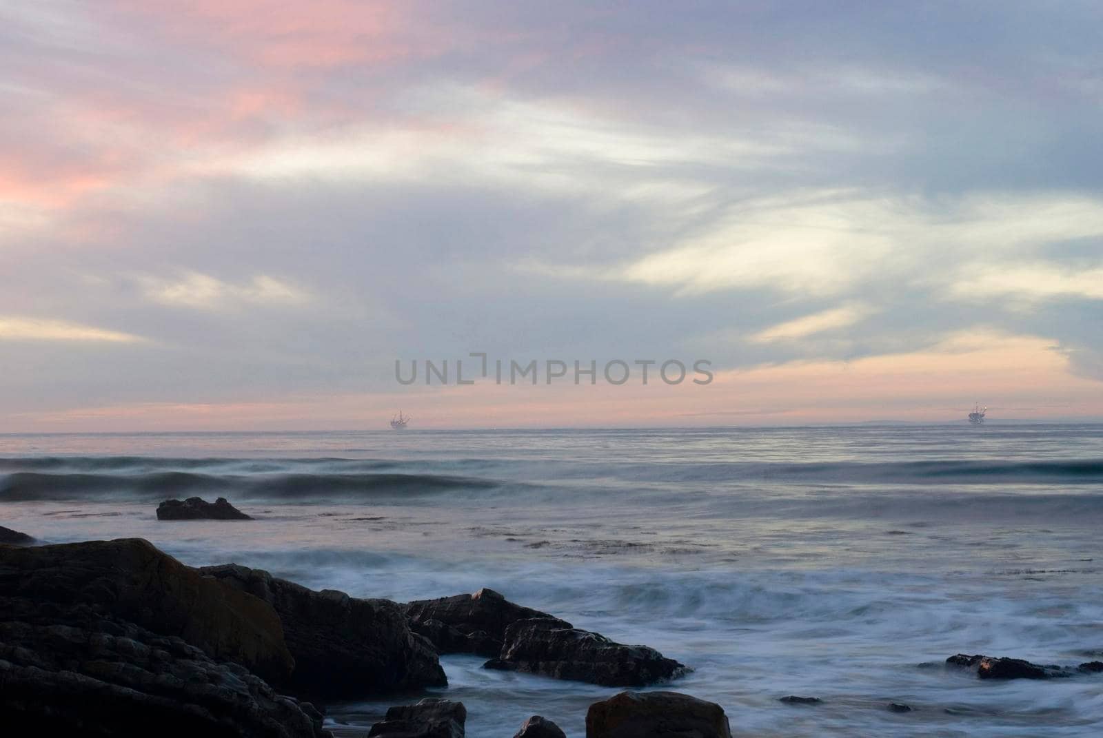sunset from refugio, orange sky and offshore oil platforms