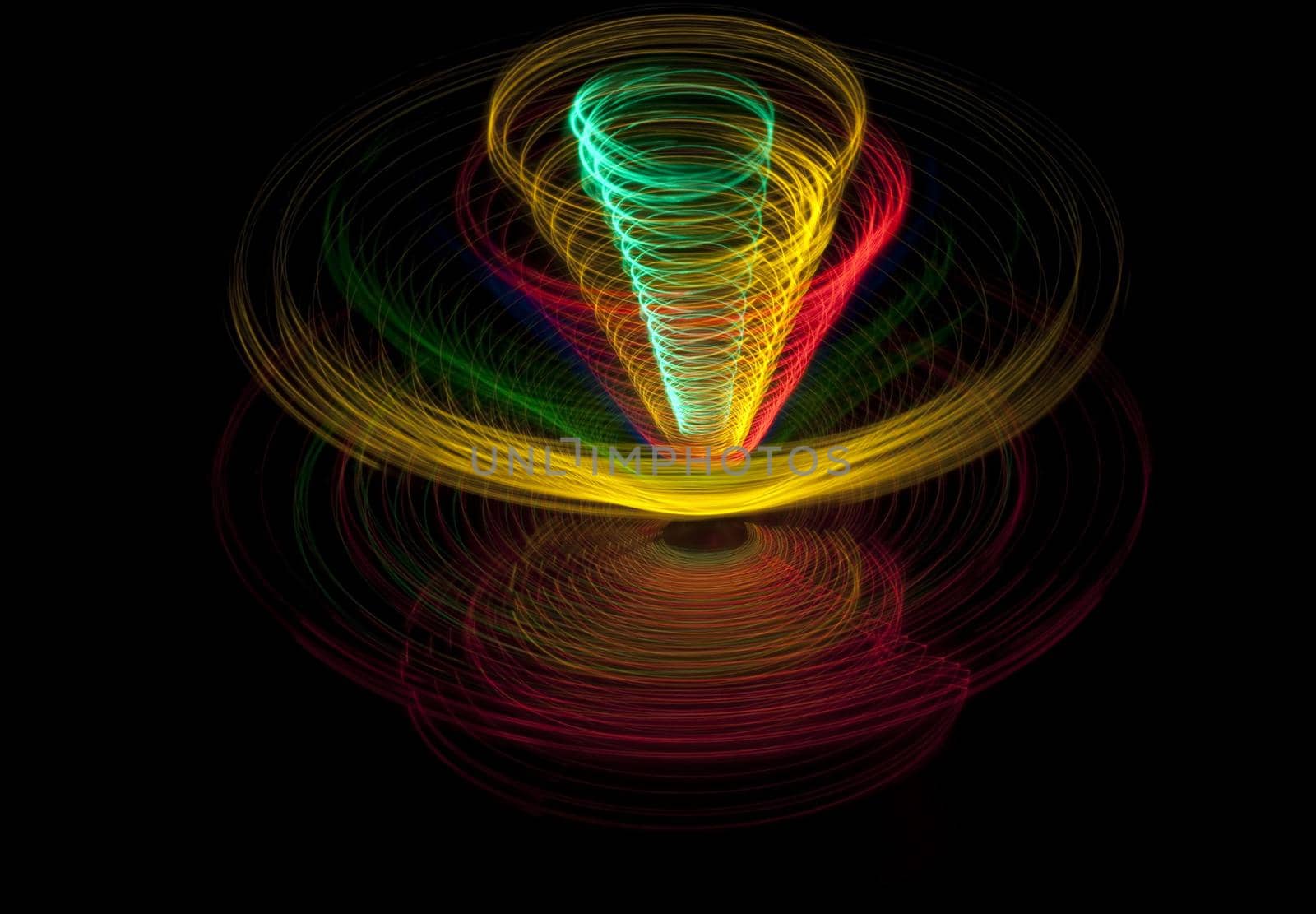 abstract pattern of coloured elipises stacked to form a conical pattern