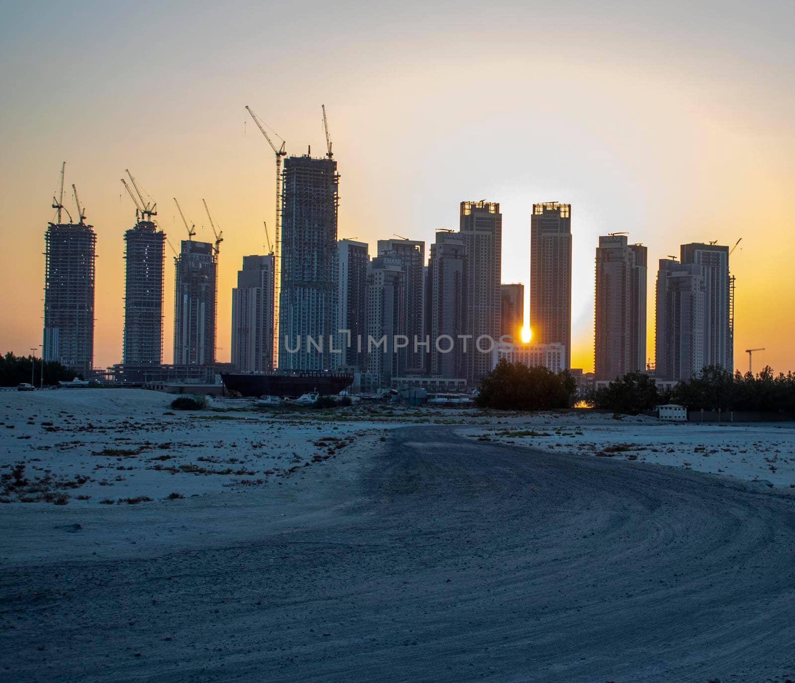 Sunrise in Jadaf area of Dubai, view of Dubai creek Harbor construction of which is partially completed. by pazemin