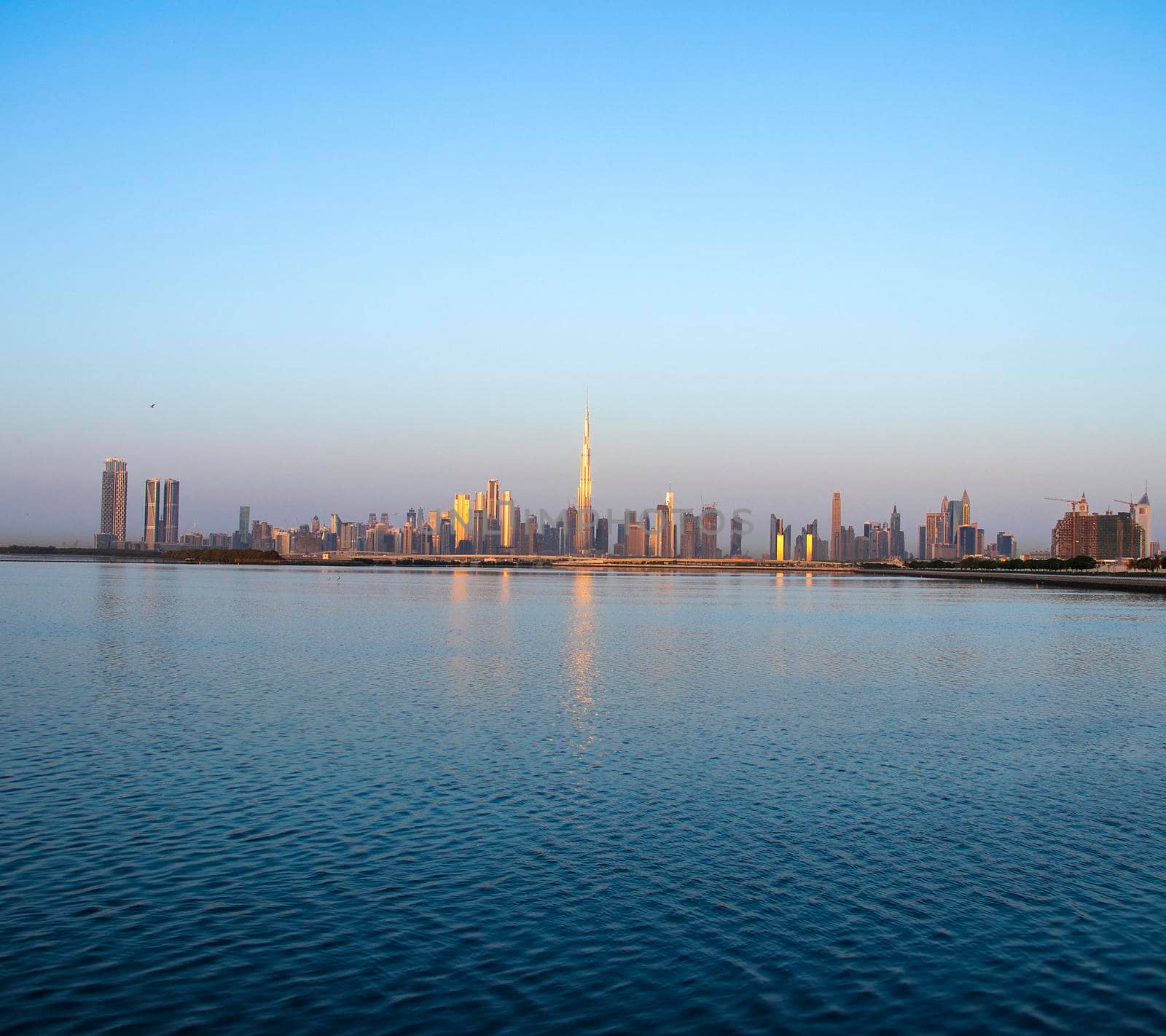 Sunrise over a skyline of a beautiful city of Dubai. Shot made in Jadaf area of the city. UAE. by pazemin