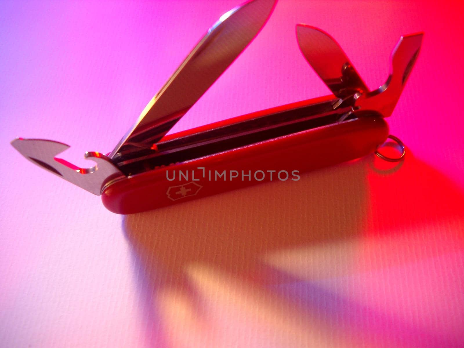 detail of the blades of a red swiss army knife
