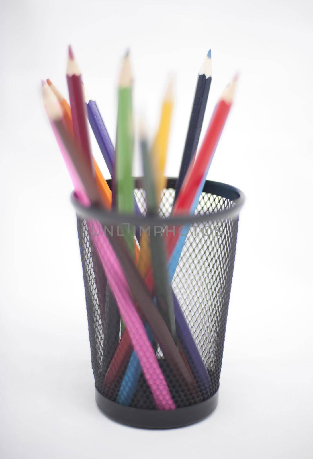 Colored pencils in black pencil basket - pictured with a shallow DOF