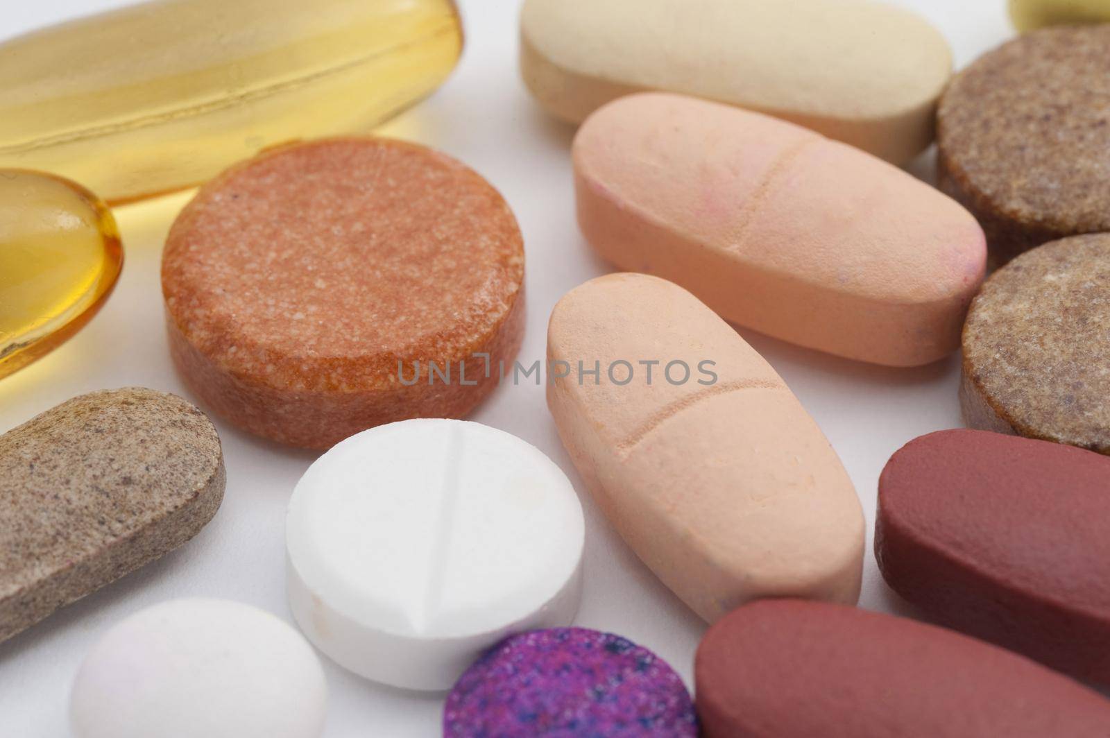an assortment of multivitimin and supplement tablets