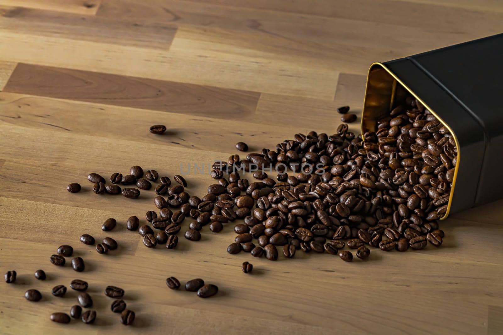 Roasted coffee beans on wooden background. High quality photo