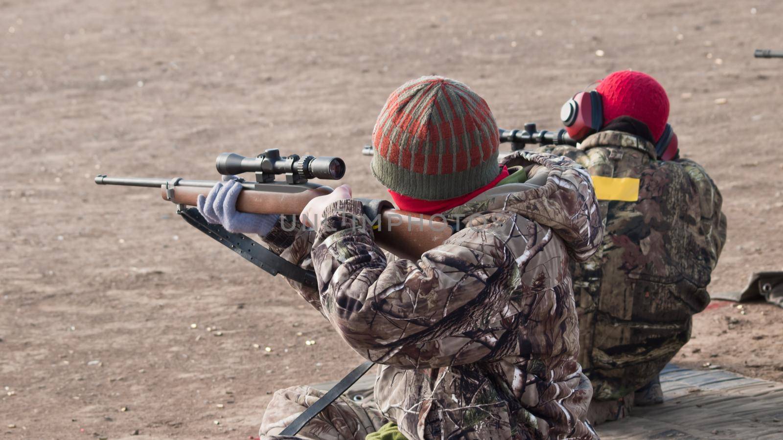 Young boys practicing rifle marksmanship at the Appleseed Project.