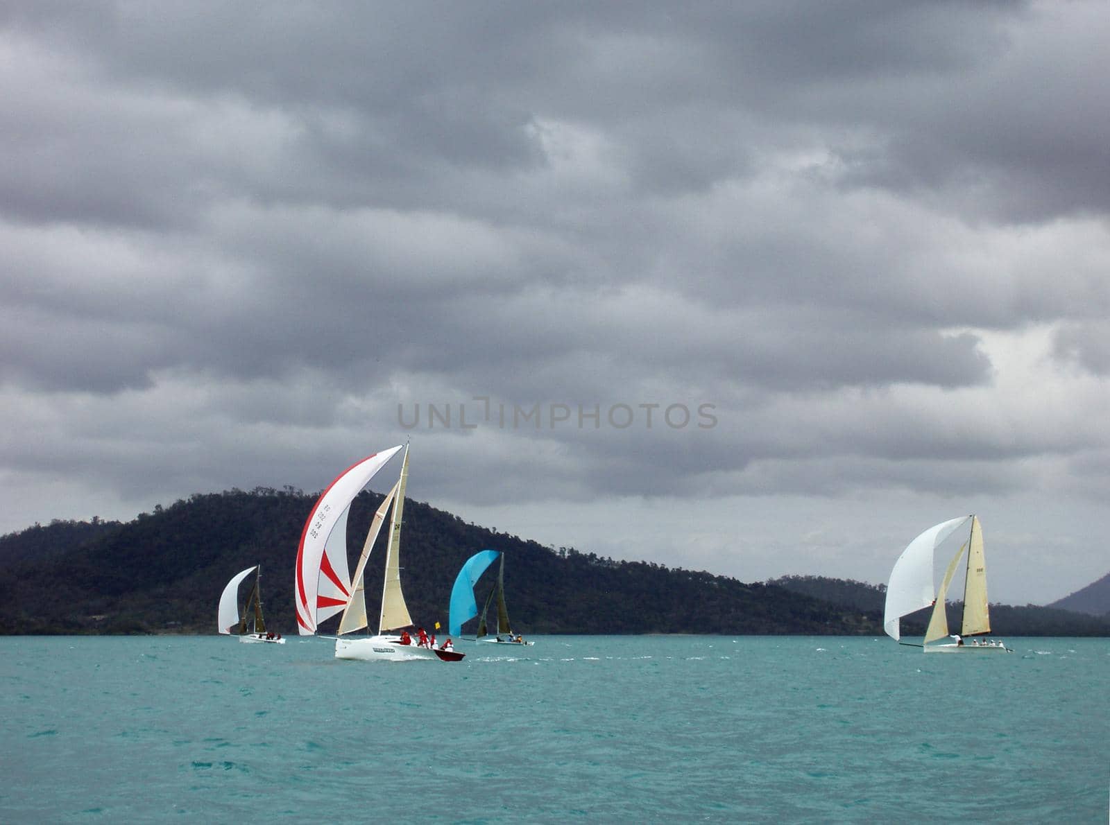 four yachts racing on a stormy looking day