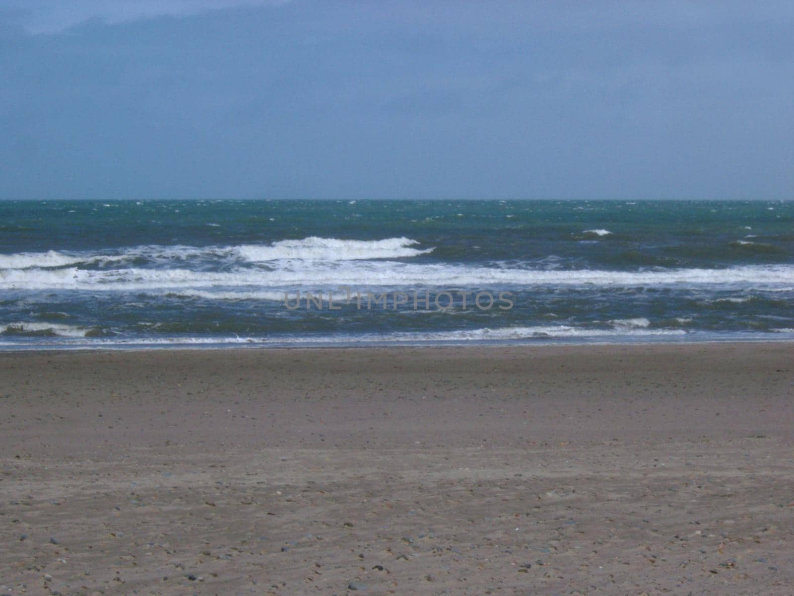 waves lapping on a sandy shoreline
