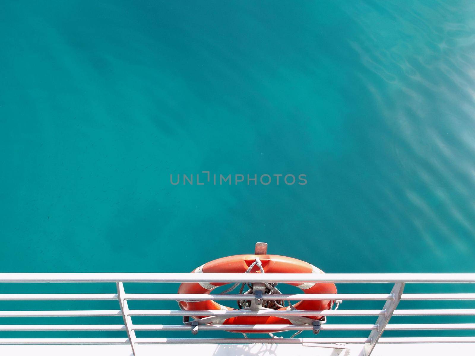 a life ring on the side of a boat, symbolic of safety and security   